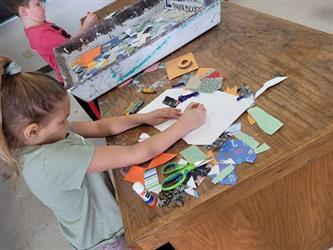 child creating a collage